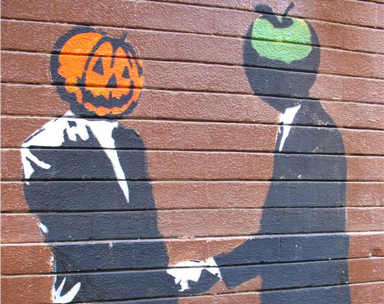 pumpkin and apple shaking hands